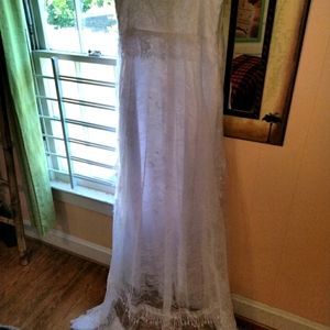 Brand new in package wedding dress  ..size 14..never worn or altered